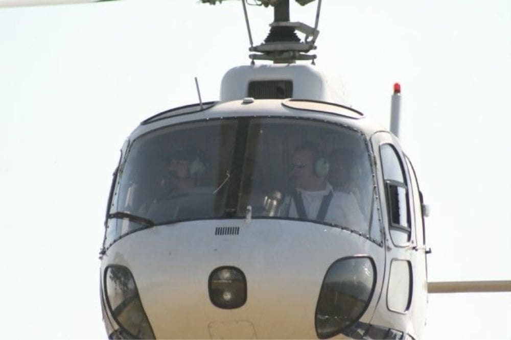 A close view into the helicopter cockpit with crew members